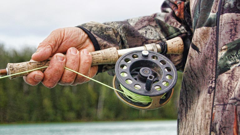 The Fishing Man With Fishing Reel