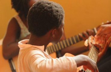 Learn Them how to play Musical instrument