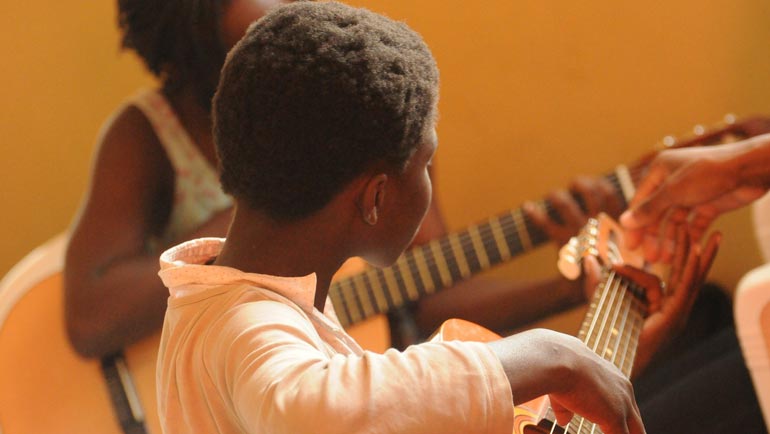 Learn Them how to play Musical instrument